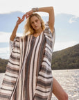 Estilo Emporio Polla Maxi Kaftan Dark Chocolate Stripe worn by model in natural setting LUXAMORE 