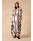 Estilo Emporio Polla Maxi Kaftan Dark Chocolate Stripe worn by model in natural setting LUXAMORE 