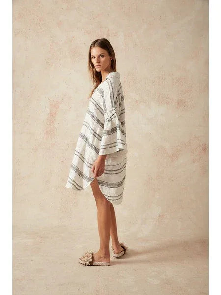 Estilo Emporio Siesta Mini Linen Dress - Lyla worn by model in natural setting LUXAMORE 