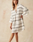 Estilo Emporio Siesta Mini Linen Dress - Lyla worn by model in natural setting LUXAMORE 