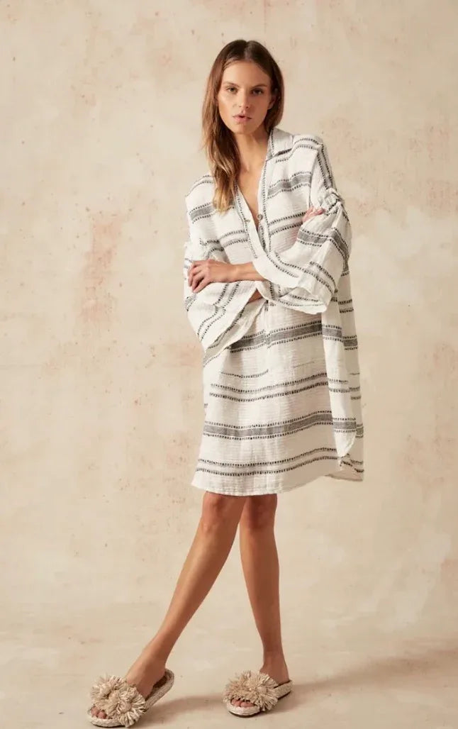 Estilo Emporio Siesta Mini Linen Dress - Lyla worn by model in natural setting LUXAMORE 