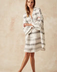 Estilo Emporio Siesta Mini Linen Dress - Lyla worn by model in natural setting LUXAMORE 