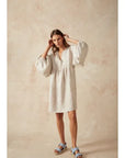 Estilo Emporio Stella Linen Dress - Lyla worn by model in natural setting LUXAMORE 