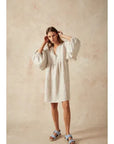 Estilo Emporio Stella Linen Dress - Lyla worn by model in natural setting LUXAMORE 