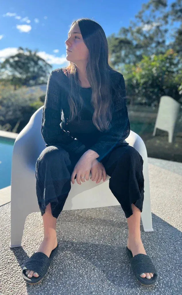 Estilo Emporio Stevie Top - Black worn by model in natural setting LUXAMORE 