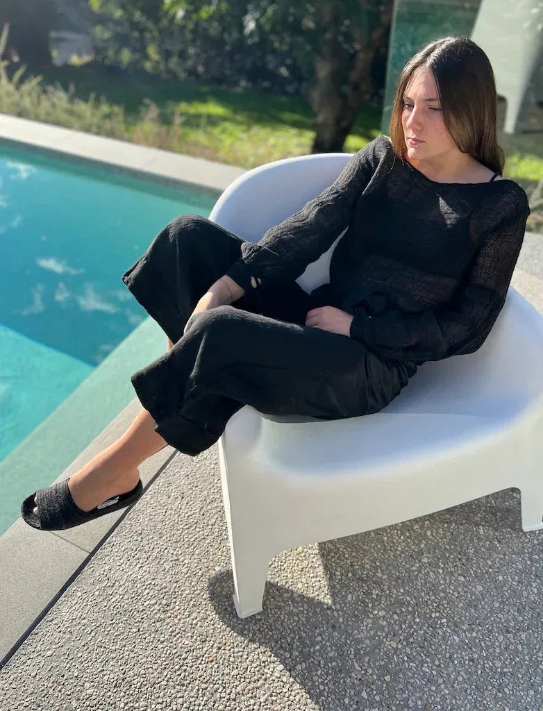 Estilo Emporio Stevie Top - Black worn by model in natural setting LUXAMORE 