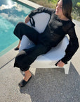 Estilo Emporio Stevie Top - Black worn by model in natural setting LUXAMORE 