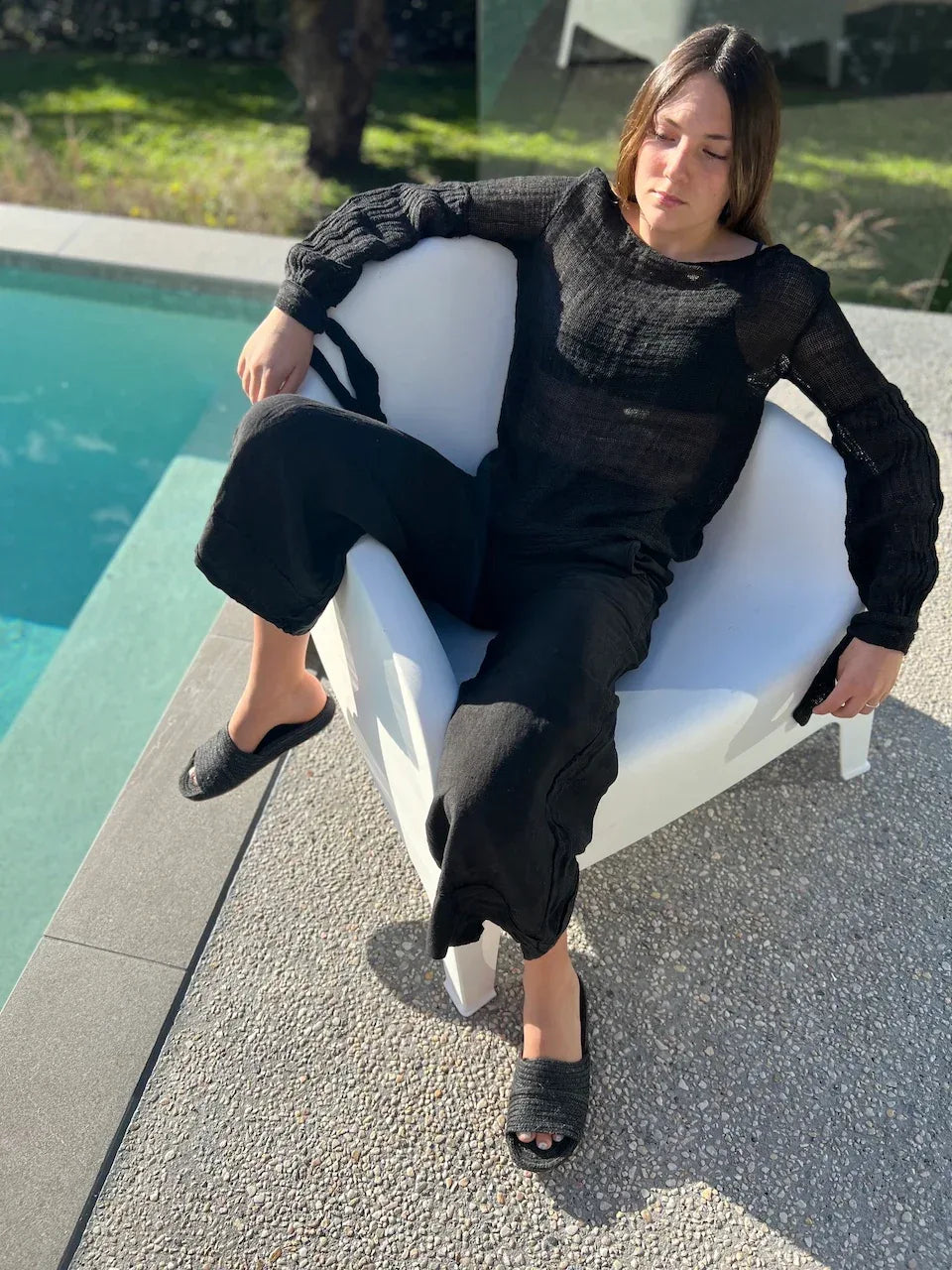 Estilo Emporio Stevie Top - Black worn by model in natural setting LUXAMORE 