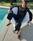 Estilo Emporio Stevie Top - Black worn by model in natural setting LUXAMORE 