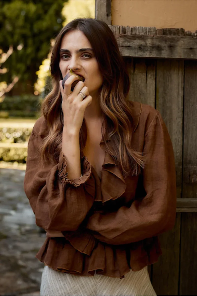 Estilo Emporio Tome Blouse - Tobacco worn by model in natural setting LUXAMORE 