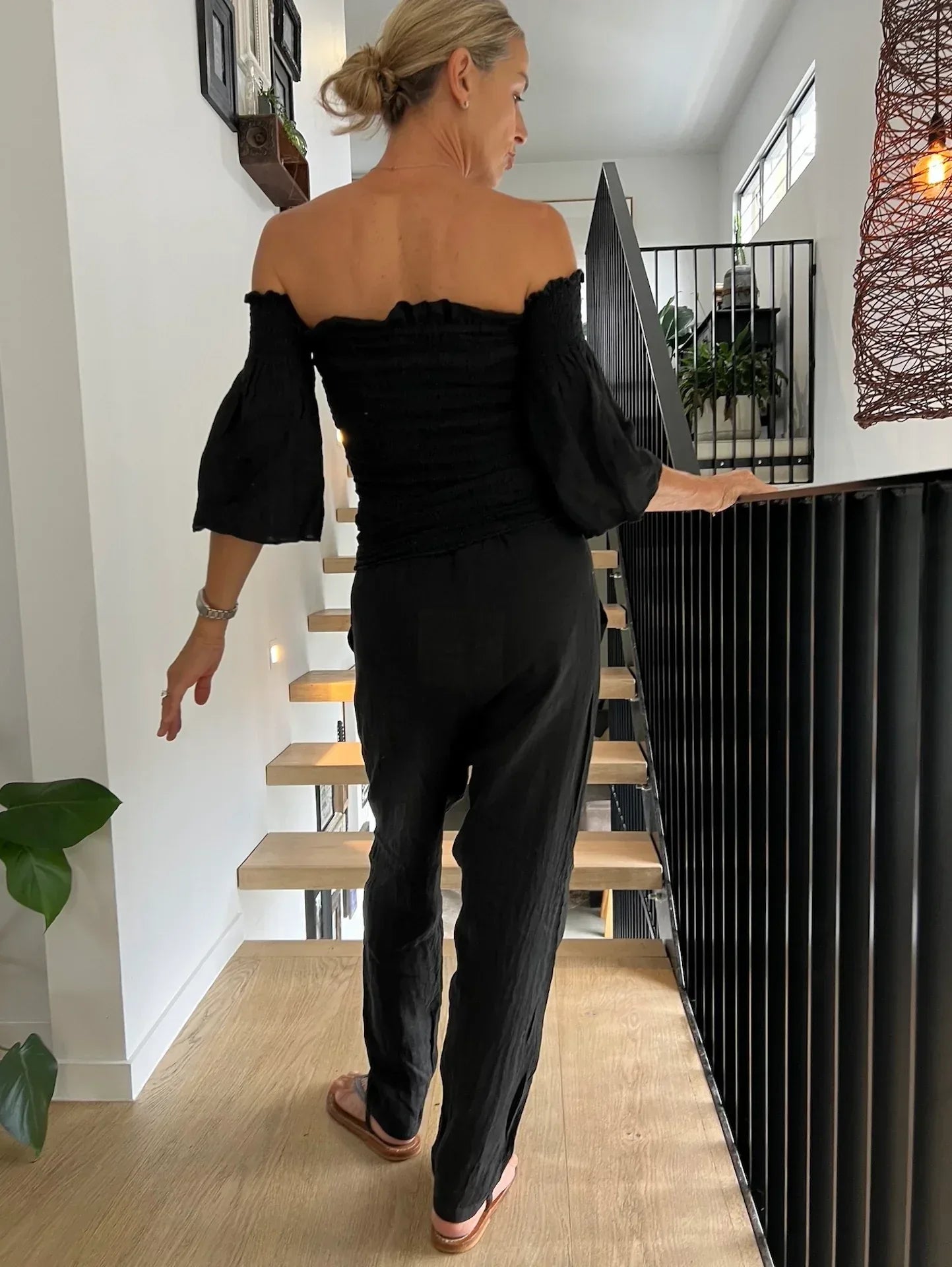 La Bottega di Brunella Pantalone Agathos Linen Pants Black worn by model in natural setting LUXAMORE 