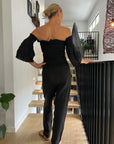 La Bottega di Brunella Pantalone Agathos Linen Pants Black worn by model in natural setting LUXAMORE 