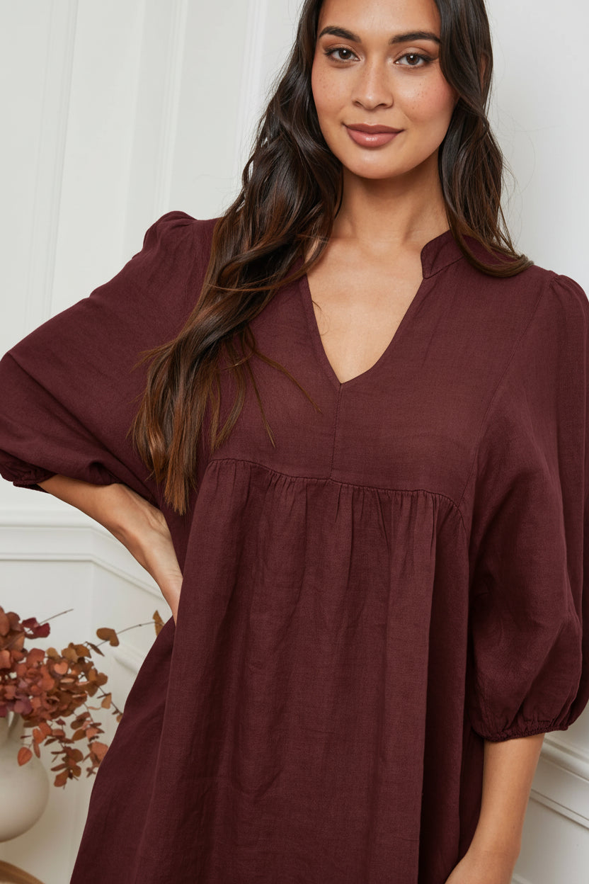 Linen Dress Balloon Sleeve - Made in Italy - bordeaux worn by model in natural setting LUXAMORE 