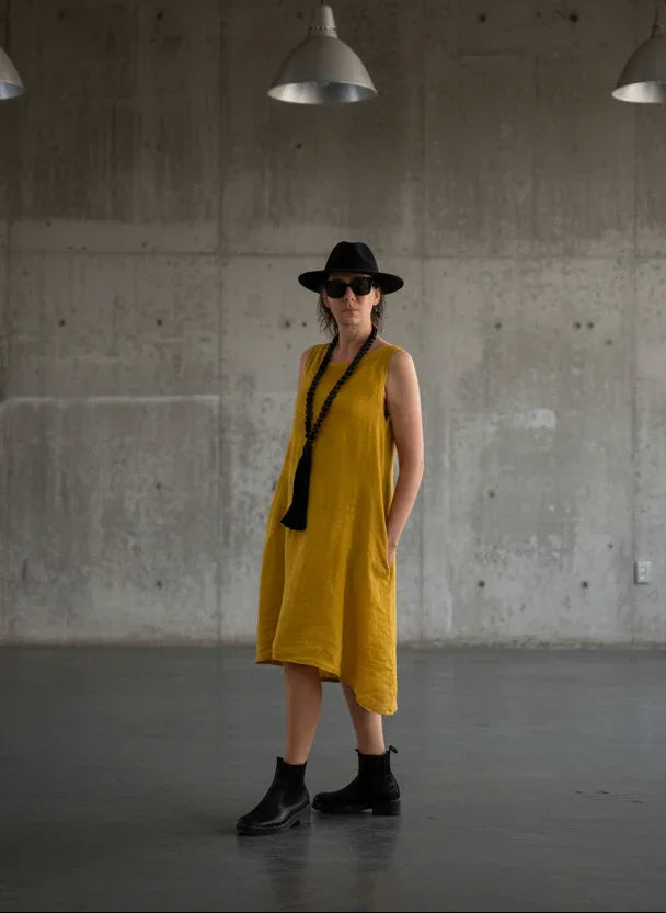 Linen Dress Midi A Line Pockets Made in Italy Yellow worn by model in natural setting LUXAMORE 