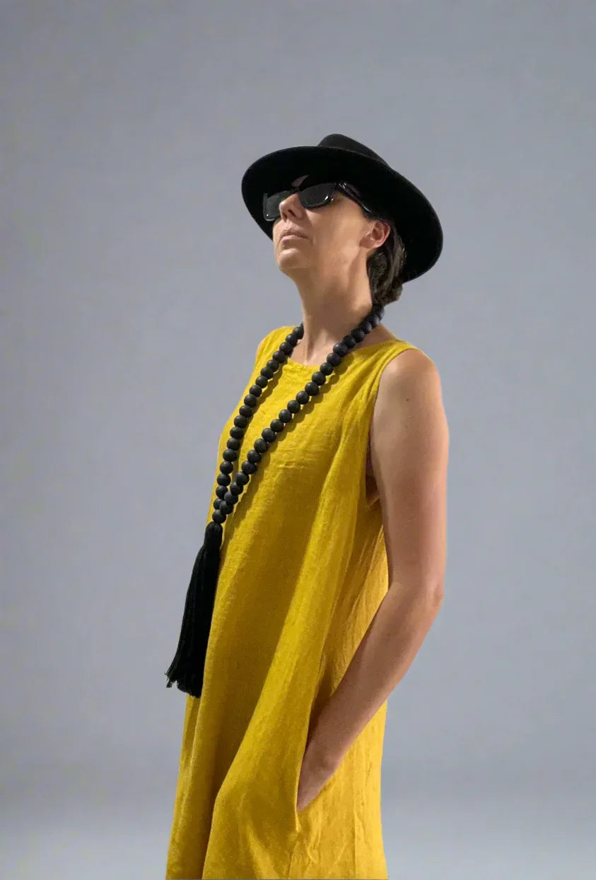 Linen Dress Midi A Line Pockets Made in Italy Yellow worn by model in natural setting LUXAMORE 