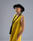 Linen Dress Midi A Line Pockets Made in Italy Yellow worn by model in natural setting LUXAMORE 