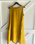 Linen Dress Midi A Line Pockets Made in Italy Yellow worn by model in natural setting LUXAMORE 