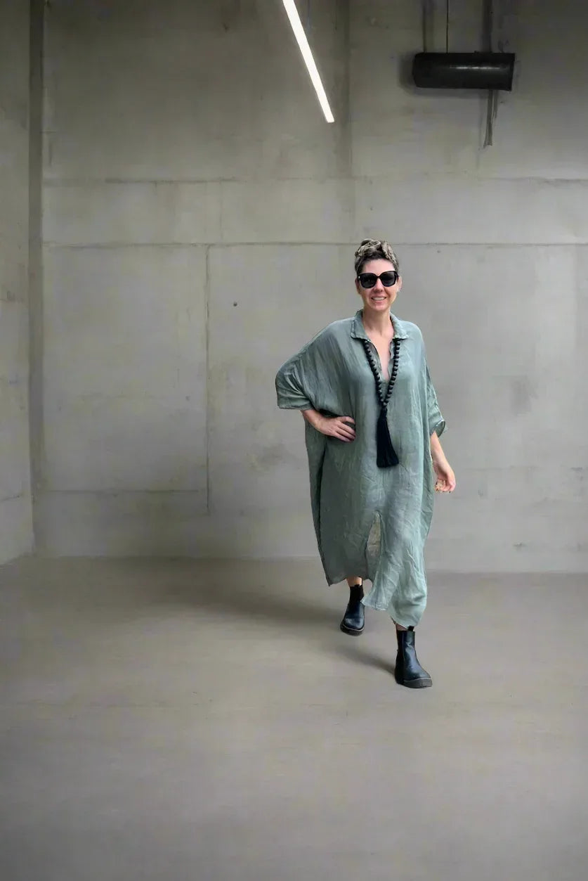 Linen Dress Oversize Maxi Kaftan Made in Italy Olive worn by model in natural setting LUXAMORE 