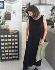 Linen Dress Sleeveless Raw Edge, Maxi Made in Italy Black worn by model in natural setting LUXAMORE 