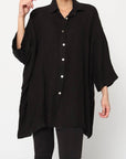Linen Shirt Relaxed Oversized Button Front Pockets made in Italy Black worn by model in natural setting LUXAMORE 