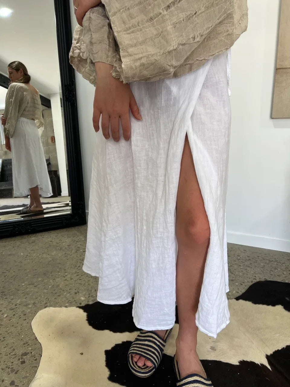 Linen Wrap Skirt With Pockets Made in Italy White worn by model in natural setting LUXAMORE 