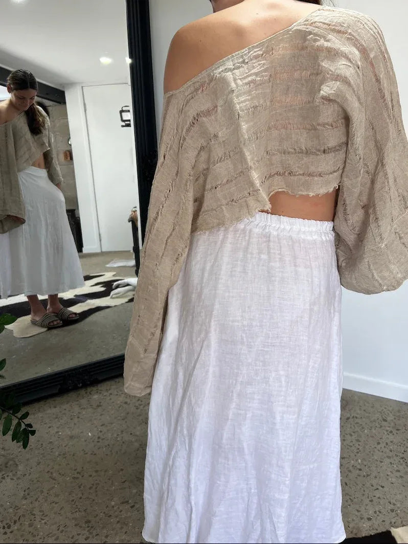 Linen Wrap Skirt With Pockets Made in Italy White worn by model in natural setting LUXAMORE 