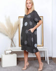 Linen Dress Circle Print Midi Made in Italy Charcoal Grey worn by model in natural setting LUXAMORE 