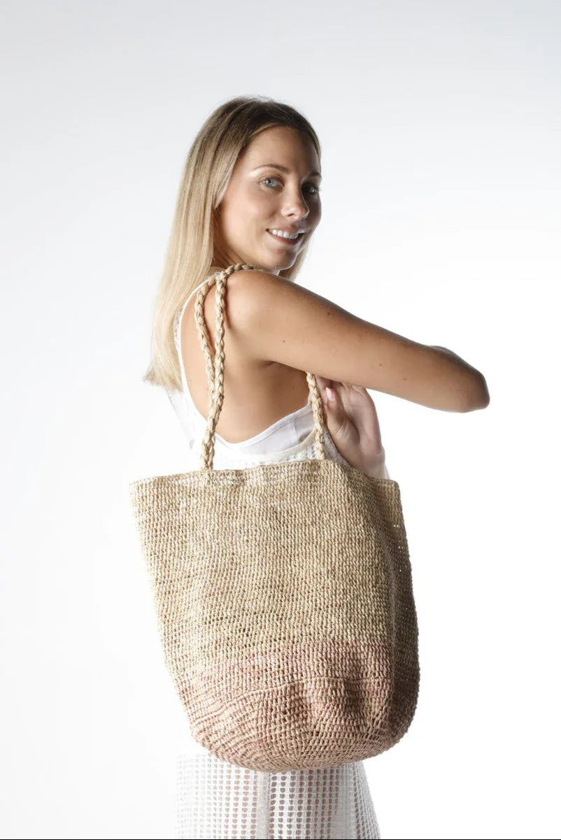 Made in Mada Bag Alice MM worn by model in natural setting LUXAMORE 