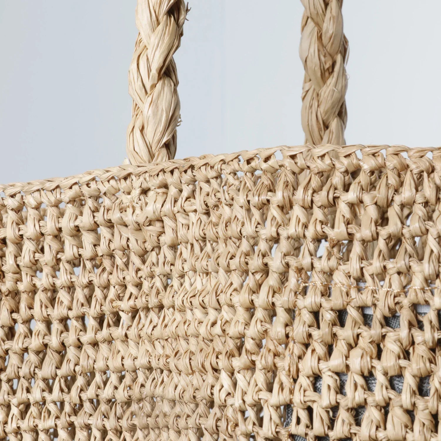 Made in Mada Bag Alice MM worn by model in natural setting LUXAMORE 