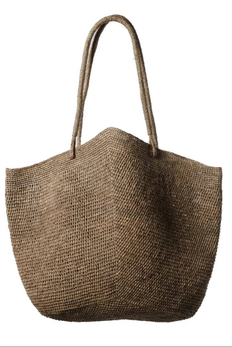 Made in Mada Bag Gemma worn by model in natural setting LUXAMORE 