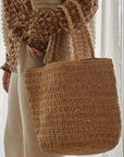 Made in Mada Bag Vony worn by model in natural setting LUXAMORE 