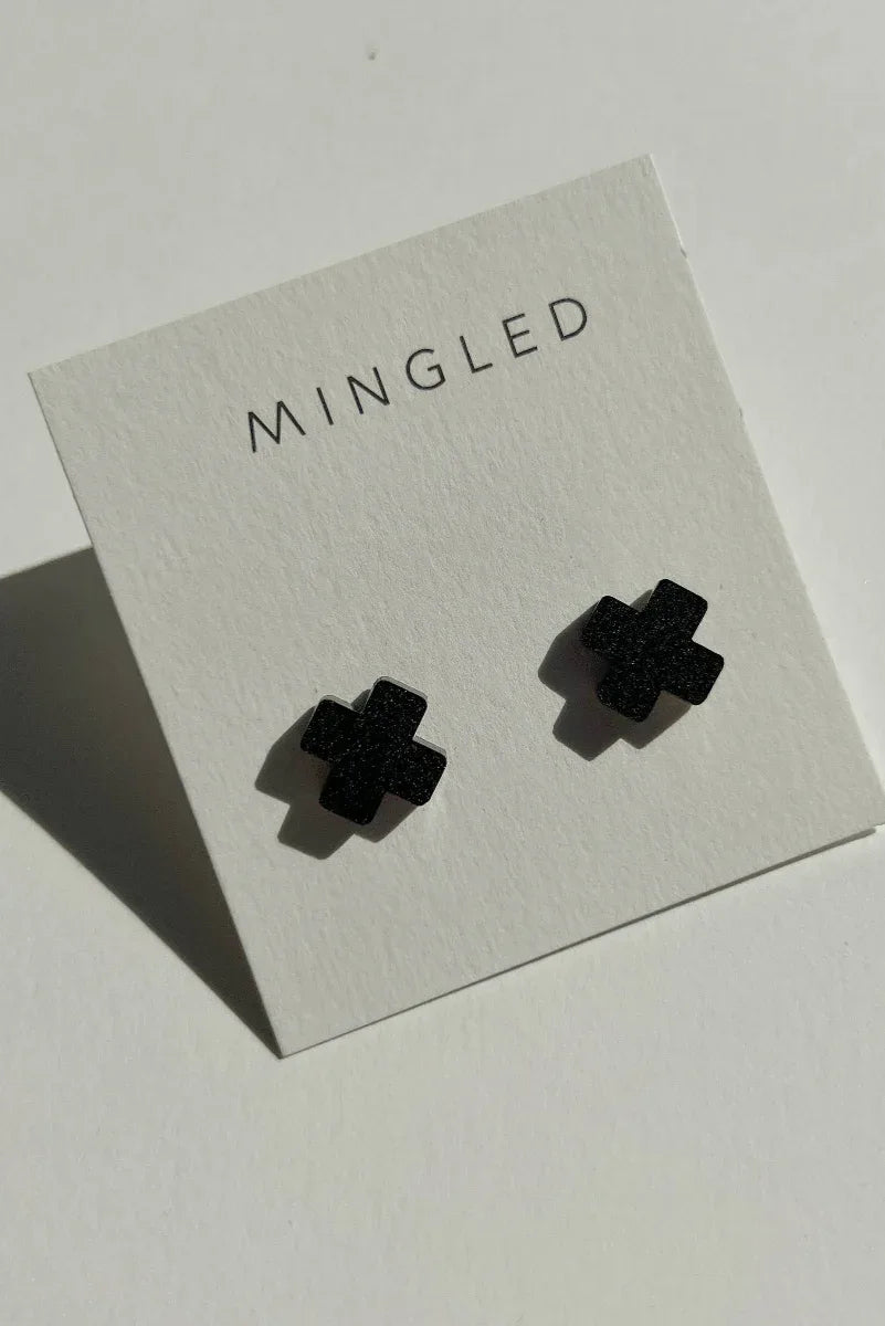 Mingled Black Cross Stud Earrings - Small Cross Earrings, Minimalist worn by model in natural setting LUXAMORE 
