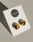 Mingled Tortoise Shell Round Stud Earrings - 15mm worn by model in natural setting LUXAMORE 