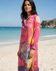Luxury resort-wear dress: Close-up of the small stand-up collar and button placket on the Miss Goodlife Sunset Dream dress.