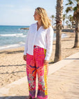 Wide-leg 7/8 trousers: Miss Goodlife Pants Sunset Dream in an all-over multicolor print with a wide waistband. LUXAMORE