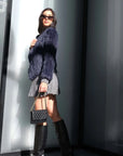 Mode & Affaire Cascade Fur Coat In Ink worn by model in natural setting LUXAMORE 