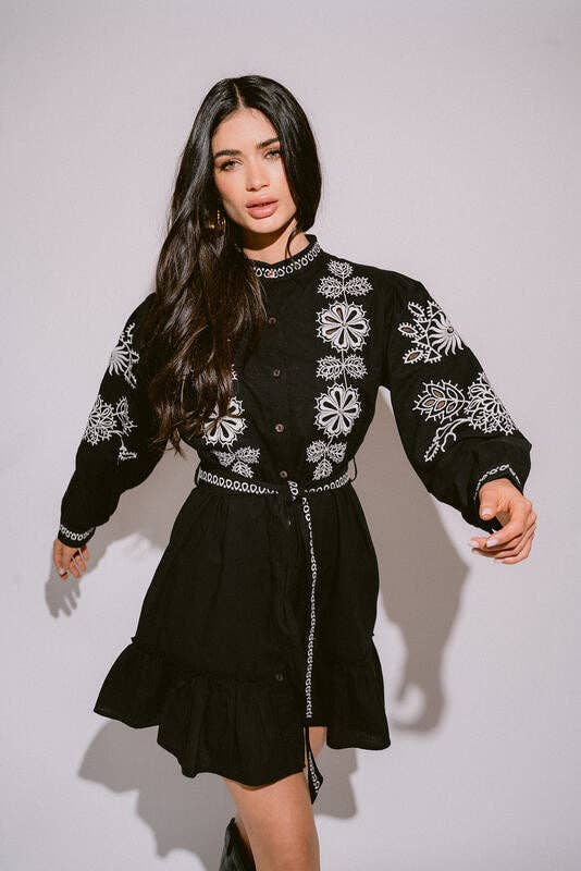 Verona Black & White Short Boho Embroidered Dress worn by model in natural setting LUXAMORE 