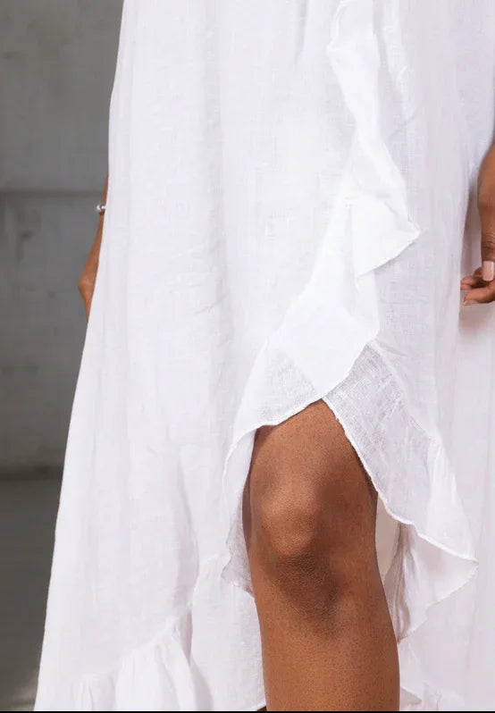 White Linen Dress Maxi Ruffled Made in Italy - One size worn by model in natural setting LUXAMORE 