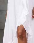 White Linen Dress Maxi Ruffled Made in Italy - One size worn by model in natural setting LUXAMORE 