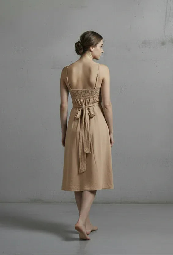 Italian Linen Dress Cross tie Coral Made in Italy worn by model in natural setting LUXAMORE 