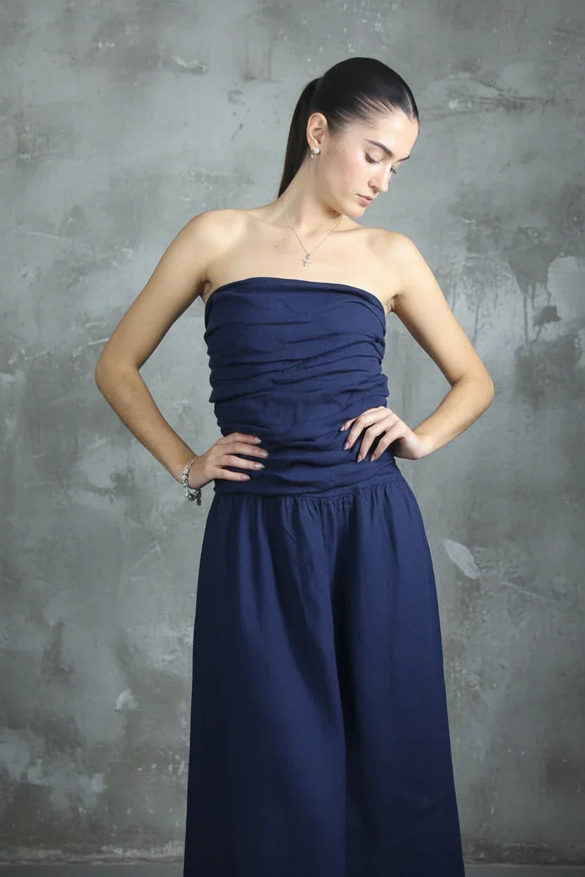 Italian Linen Dress Strapless Navy worn by model in natural setting LUXAMORE 