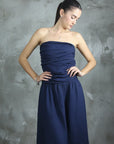 Italian Linen Dress Strapless Navy worn by model in natural setting LUXAMORE 