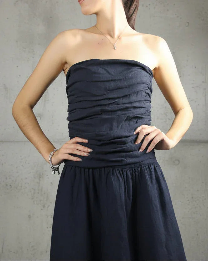 Italian Linen Dress Strapless Navy worn by model in natural setting LUXAMORE 