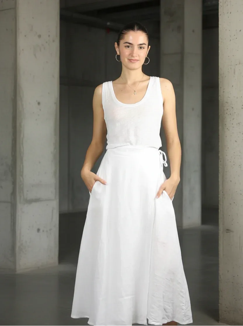 Linen Wrap Skirt With Pockets Made in Italy White worn by model in natural setting LUXAMORE 