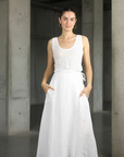 Linen Wrap Skirt With Pockets Made in Italy White worn by model in natural setting LUXAMORE 