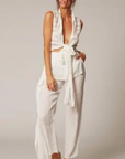 Estilo Emporio Linen Pant Coco worn by model in natural setting LUXAMORE 