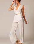 Estilo Emporio Linen Pant Coco worn by model in natural setting LUXAMORE 