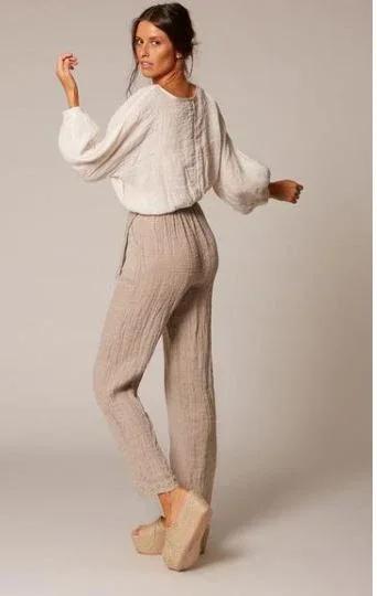 Estilo Emporio Poppy Top worn by model in natural setting LUXAMORE 