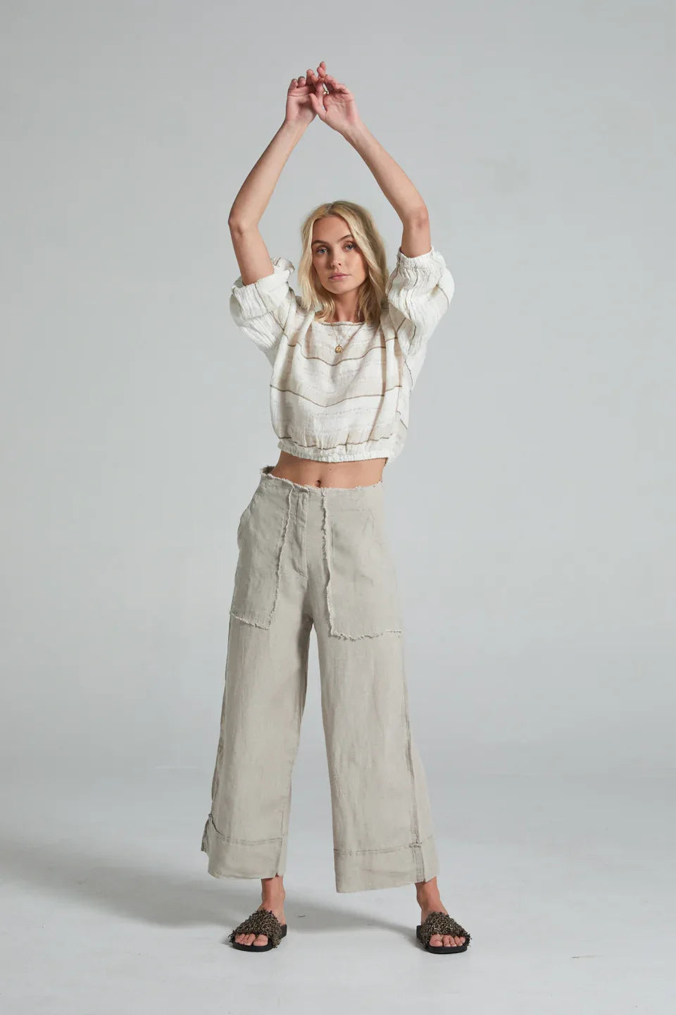 Estilo Emporio Linen Pant Riviera worn by model in natural setting LUXAMORE 