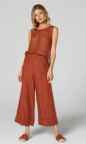 Estilo Emporio Linen Pant Tropez - Rust worn by model in natural setting LUXAMORE 